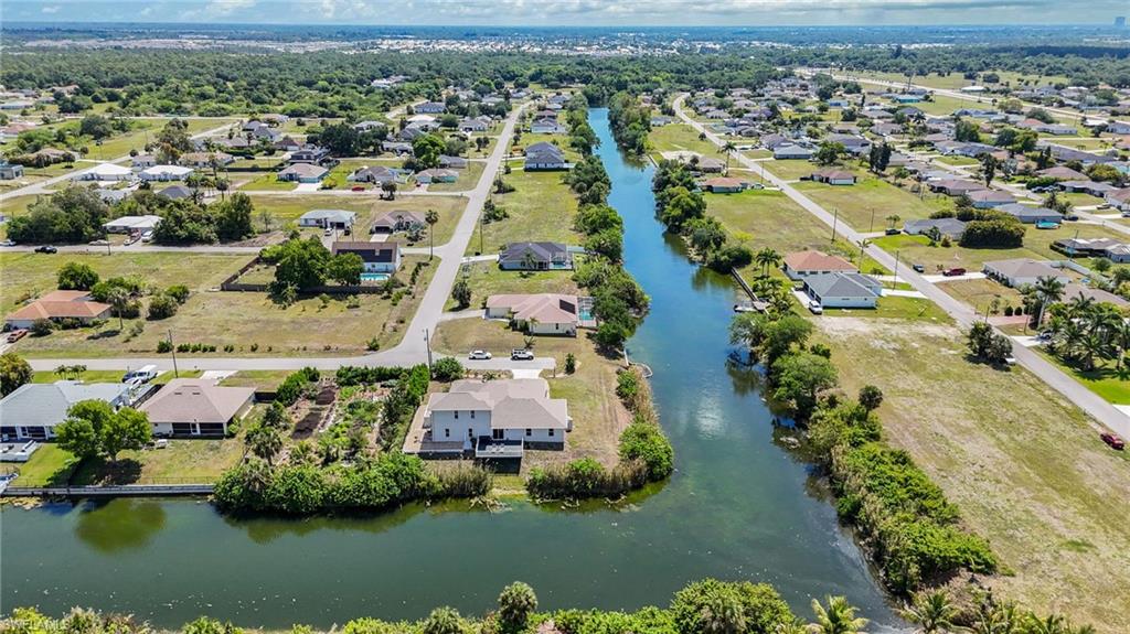 Located on an oversized lot on two intersecting freshwater canals.