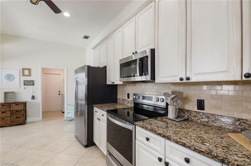 Stainless steel appliances and granite counter tops.