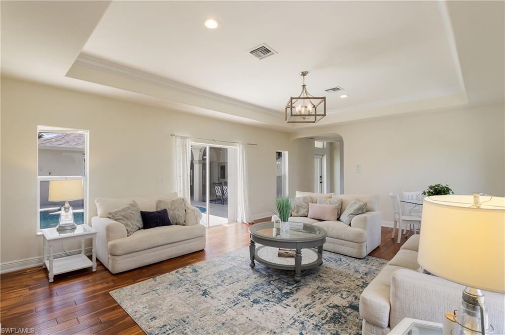 The living area has direct access to the courtyard pool area.
