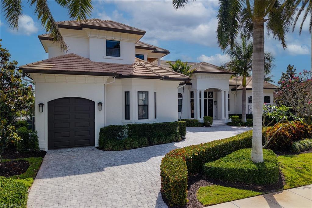 Stucco exterior with a tile roof and arched entryways