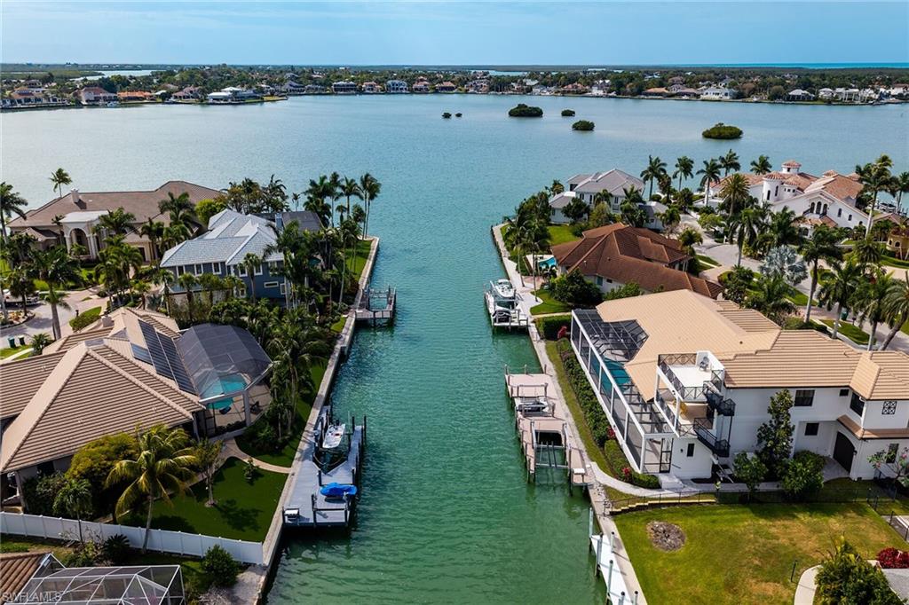 Canal-front property featuring a private boat dock and direct water access