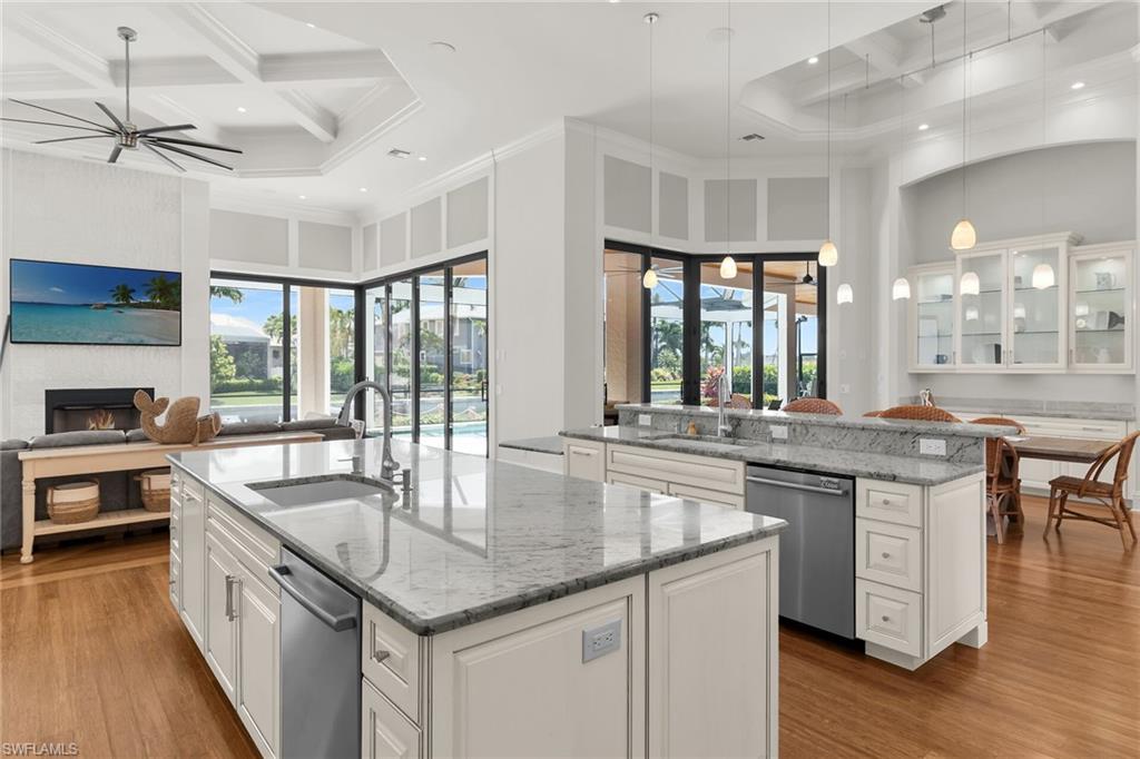 Open-concept living space with wood-finish flooring