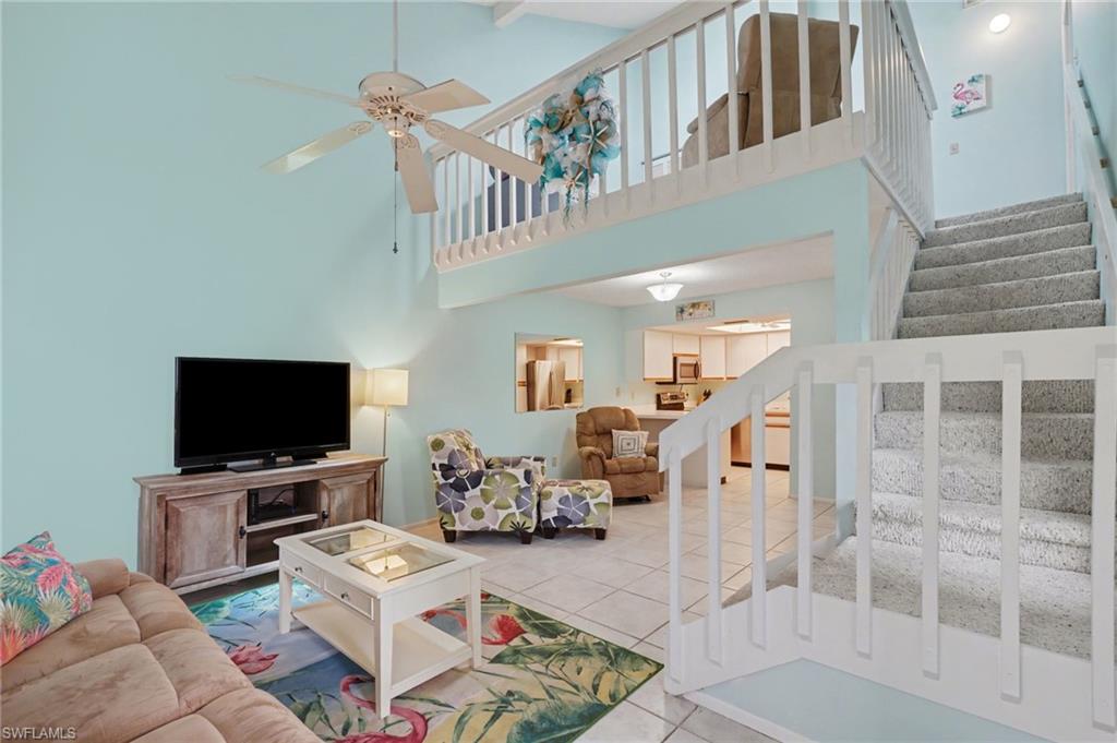 Stair case leads to upstairs bedroom and bonus loft area, and laundry