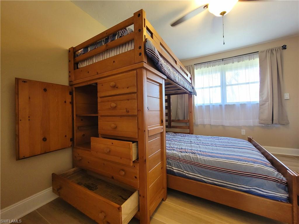 Room featuring light wood-finish flooring and a window with natural light