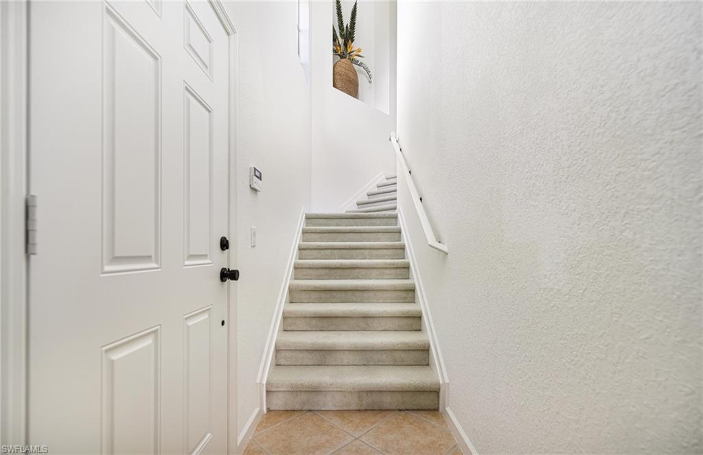 Stairway with tile patterned floors