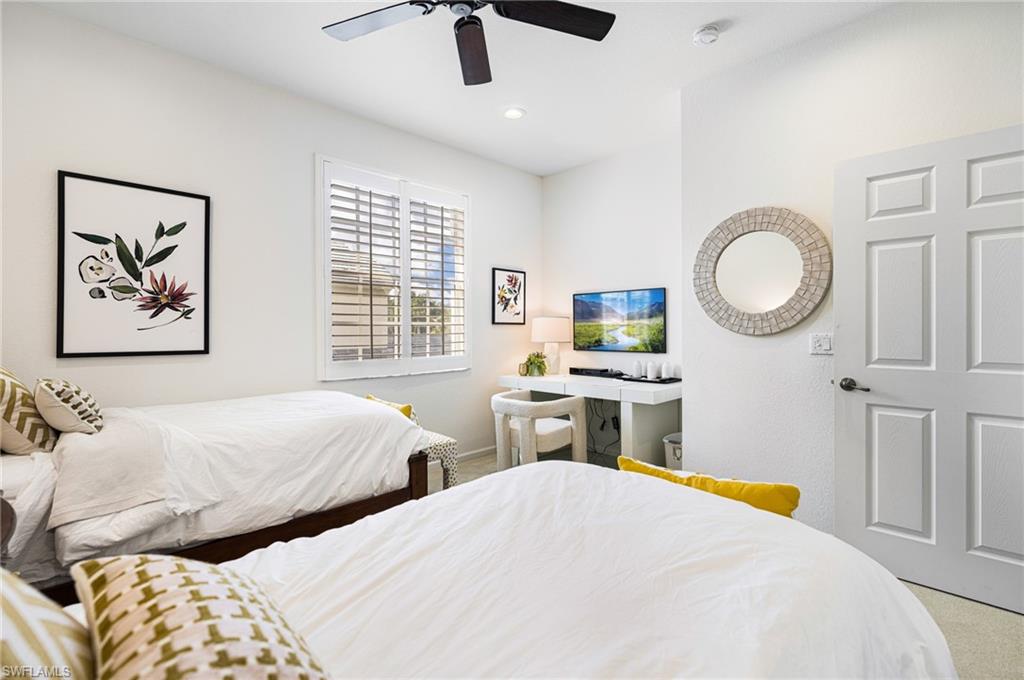 Bedroom featuring carpet floors and ceiling fan