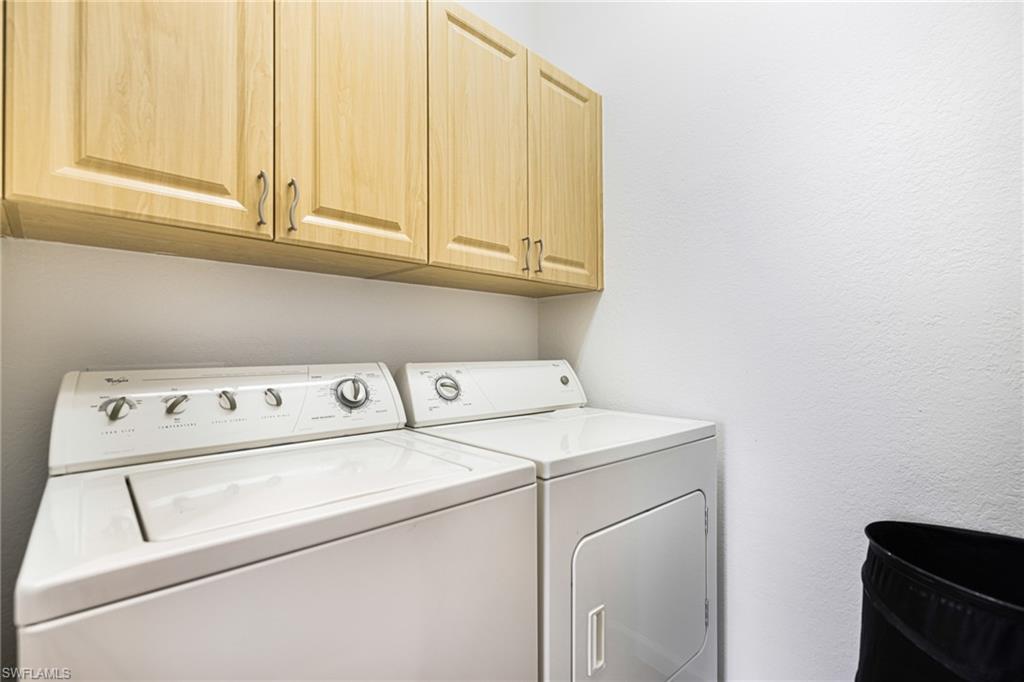 Laundry area with cabinets and washing machine and dryer