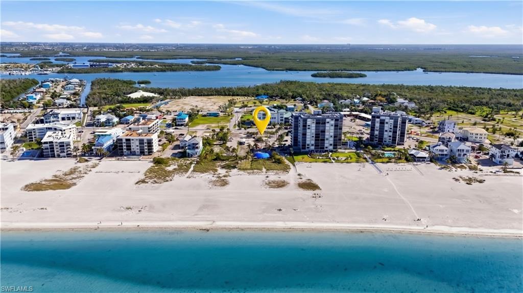 Coastal property featuring direct beach access and a beachfront location