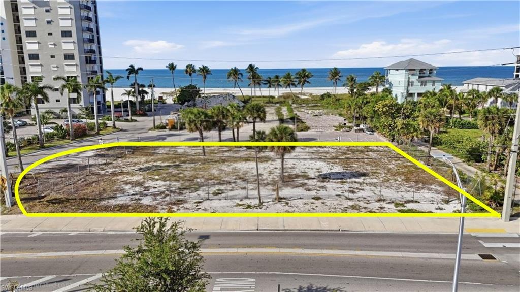 Expansive cleared lot featuring partial perimeter fencing - Virtually Edited Image
