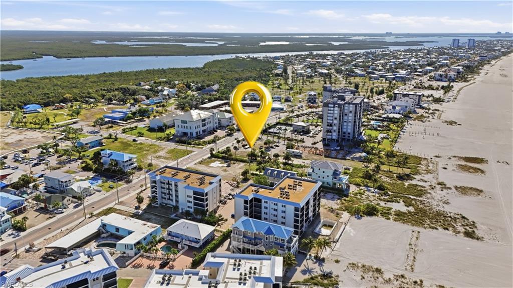 Coastal community featuring sandy beaches, waterfront access, and diverse architectural styles - Virtually Edited Image