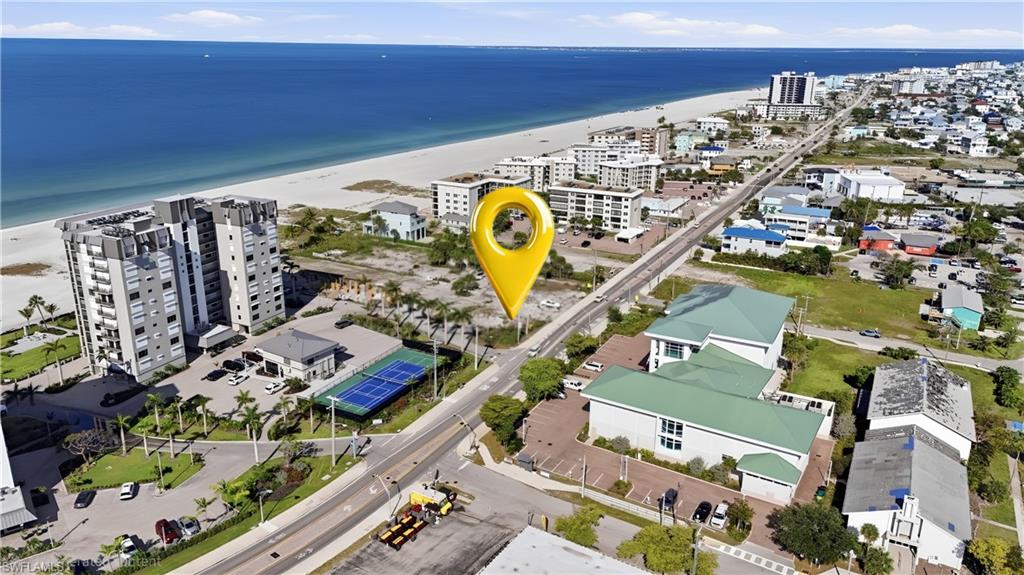 Aerial perspective showcasing a coastal community with direct beach access - Virtually Edited Image