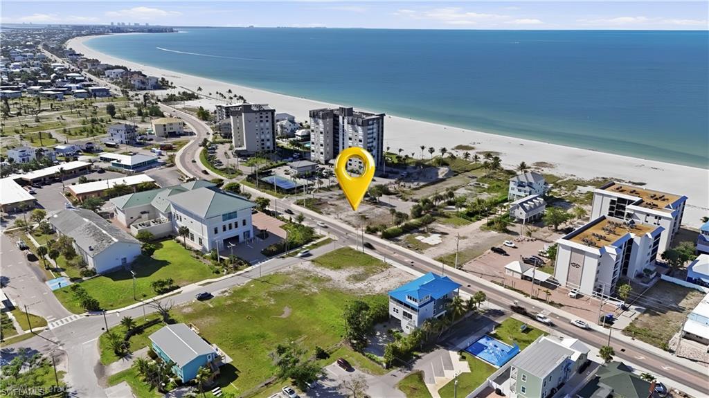 Expansive coastal area featuring a broad sandy beach and open water - Virtually Edited Image
