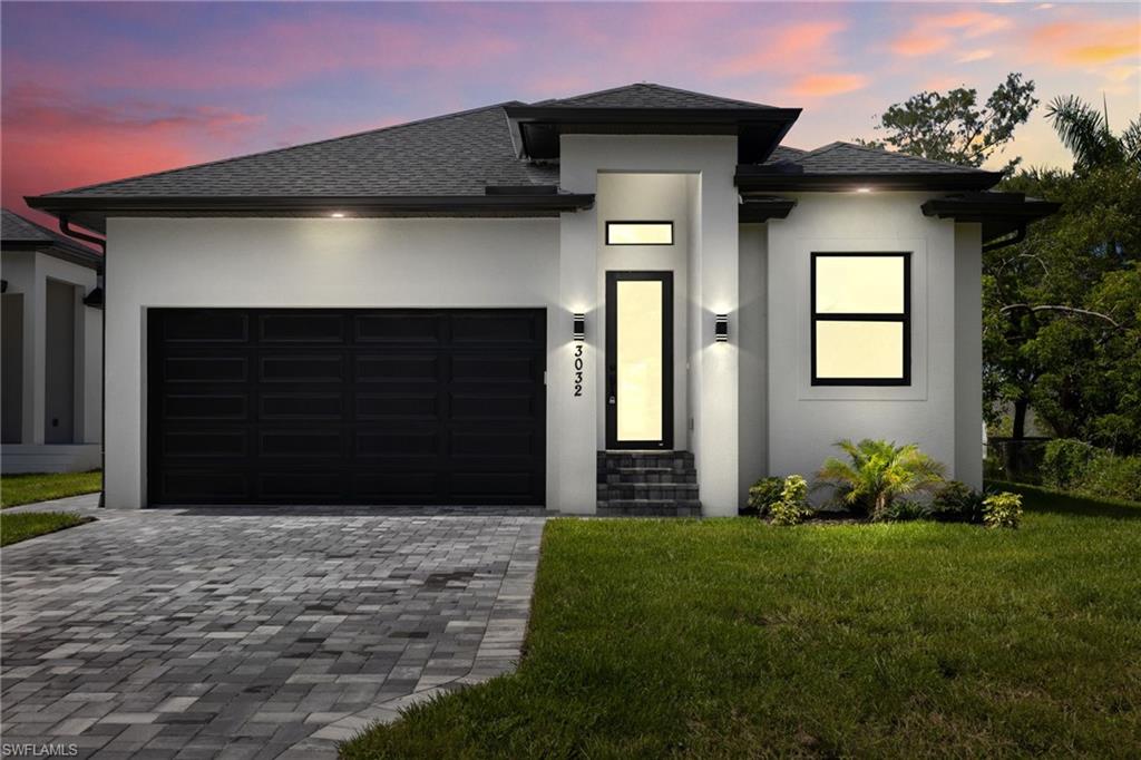 Modern architecture with a white stucco facade and black trim accents