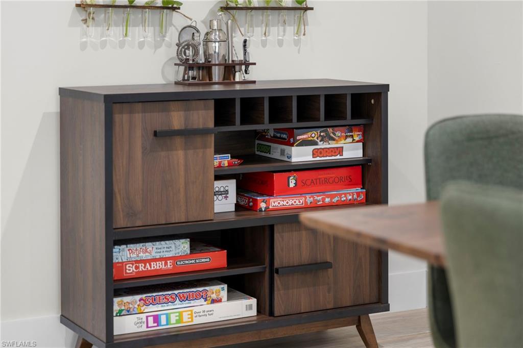 Wood-finish storage cabinet with integrated shelving and closed-door compartments