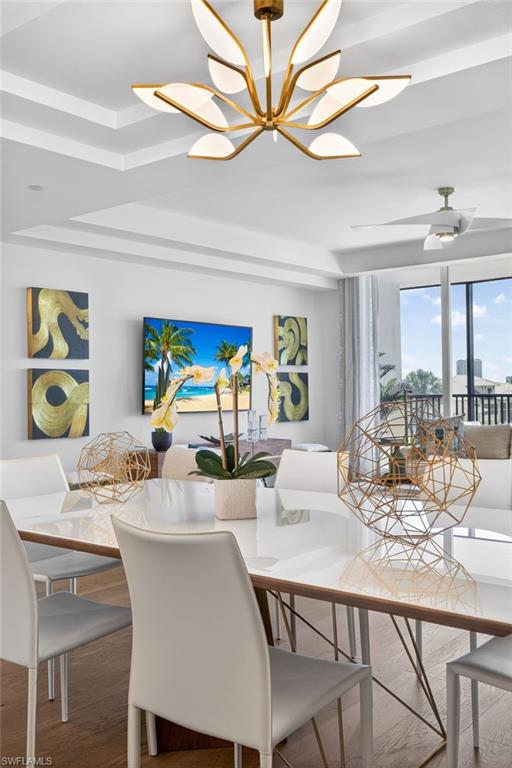 Recessed ceiling with an ornate gold-tone chandelier,