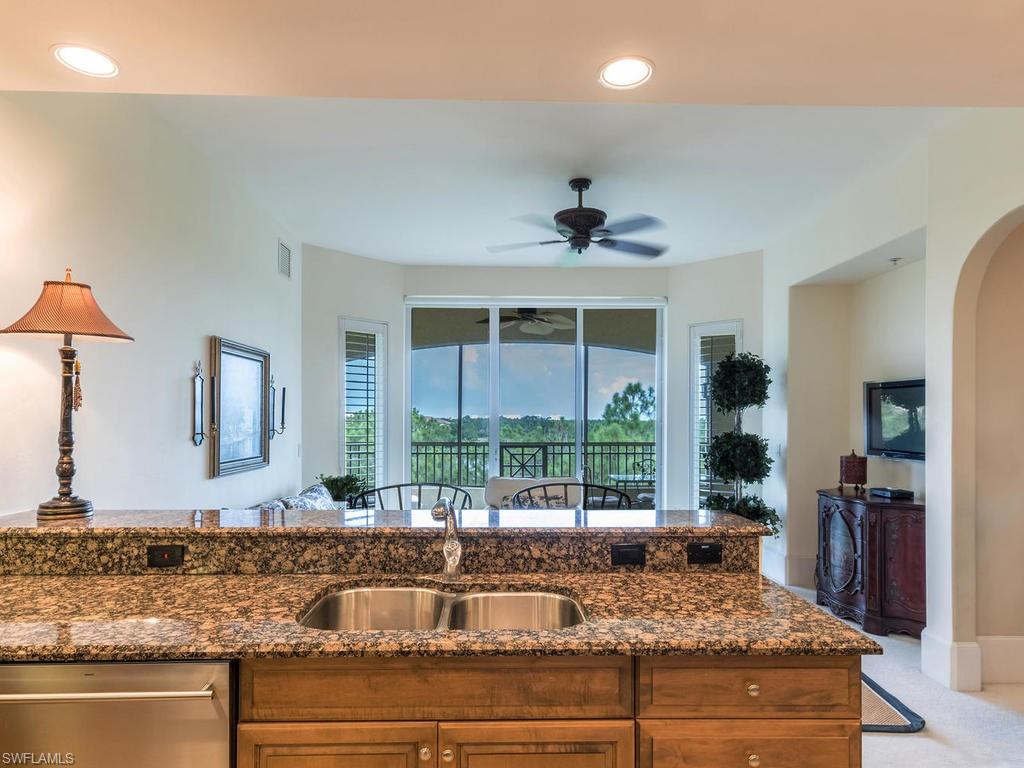 Breakfast bar open to the family room & balcony