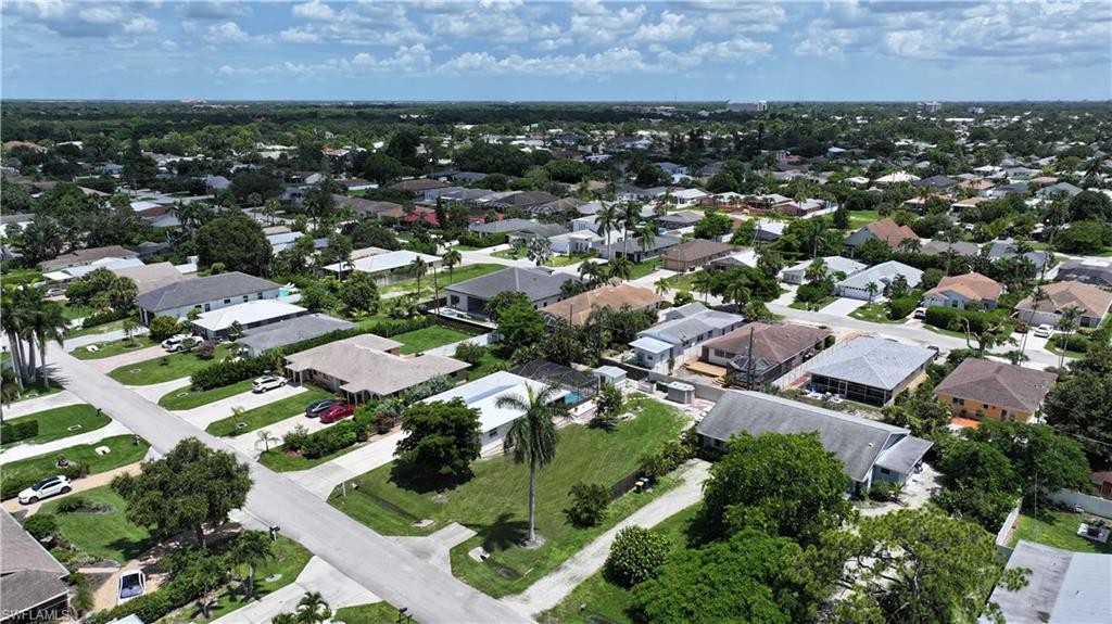 Aerial overview of property's location with nearby suburban area