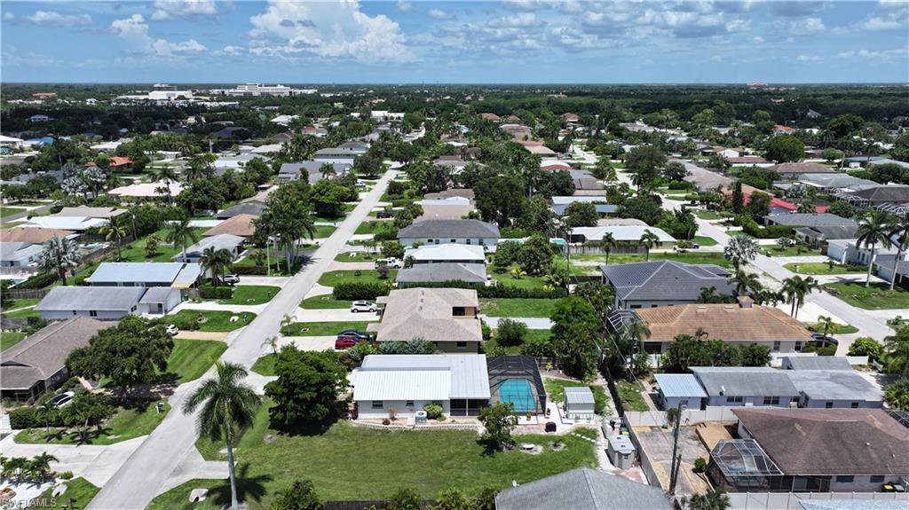 Aerial overview of property's location featuring nearby suburban area