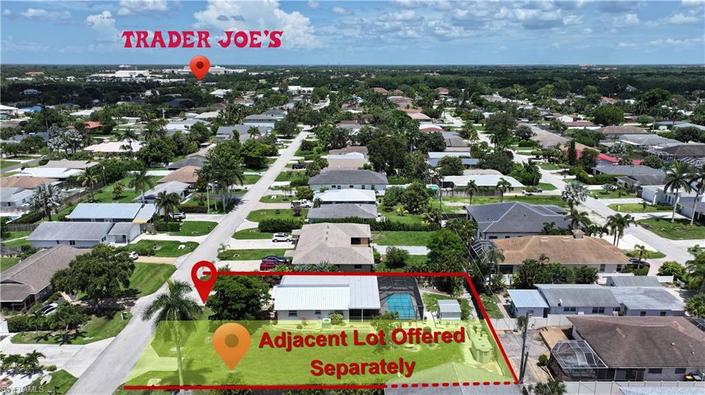 Aerial perspective showcasing a residential neighborhood with a prominent street grid