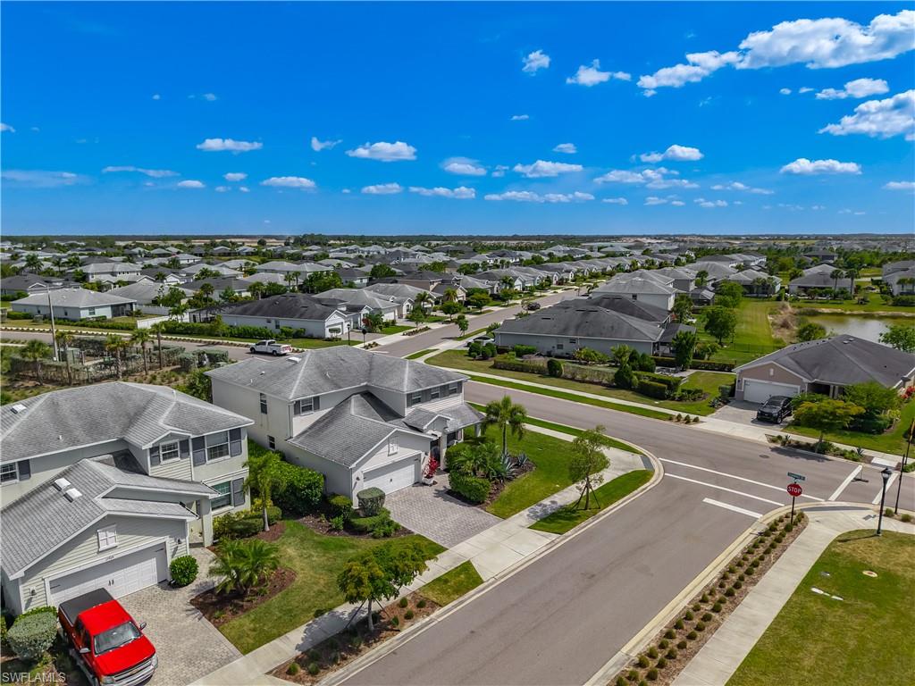 Aerial perspective showcasing a residential community with single-family homes and mature landscaping