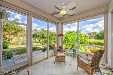 Sunroom / solarium with tile patterned floors and plenty of natural light