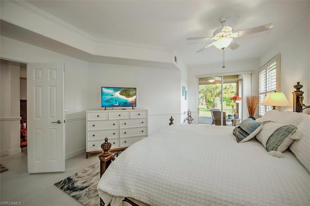 Bedroom with access to exterior, ceiling fan, and crown molding