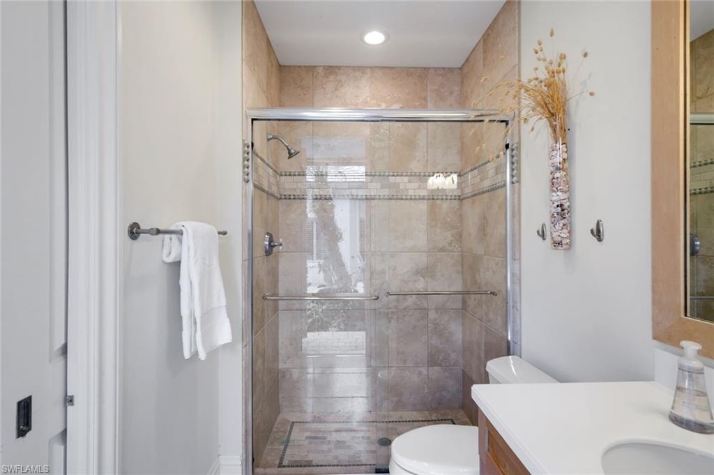 Cabana En-Suite Bath w. French Door to Lanai; Wall-to-Ceiling Stone Tile w. Designer Detail