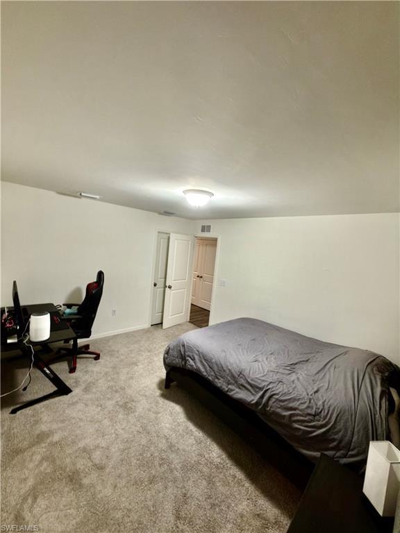 Spacious room featuring neutral carpeting and white wall finishes