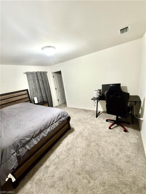 Spacious walk-in closet featuring light-toned carpet, white walls, and built-in wire shelving and hanging rods
