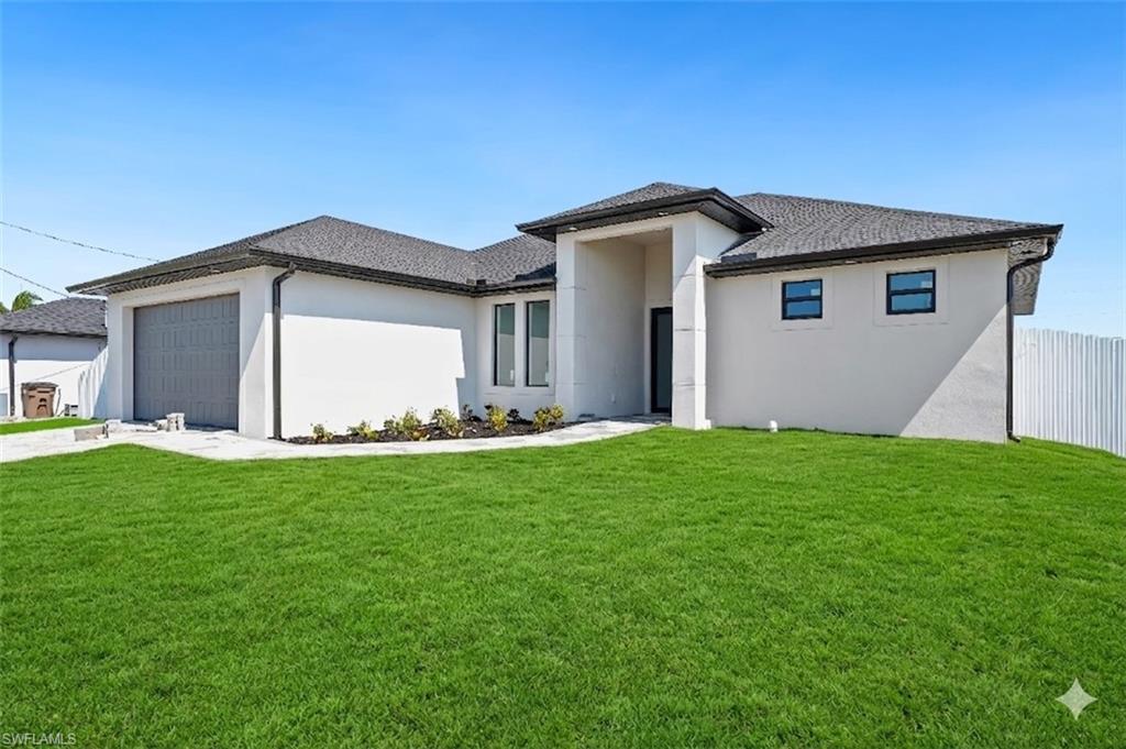 Contemporary single-story residence featuring a dark shingle roof, light stucco exterior, and a two-car garage