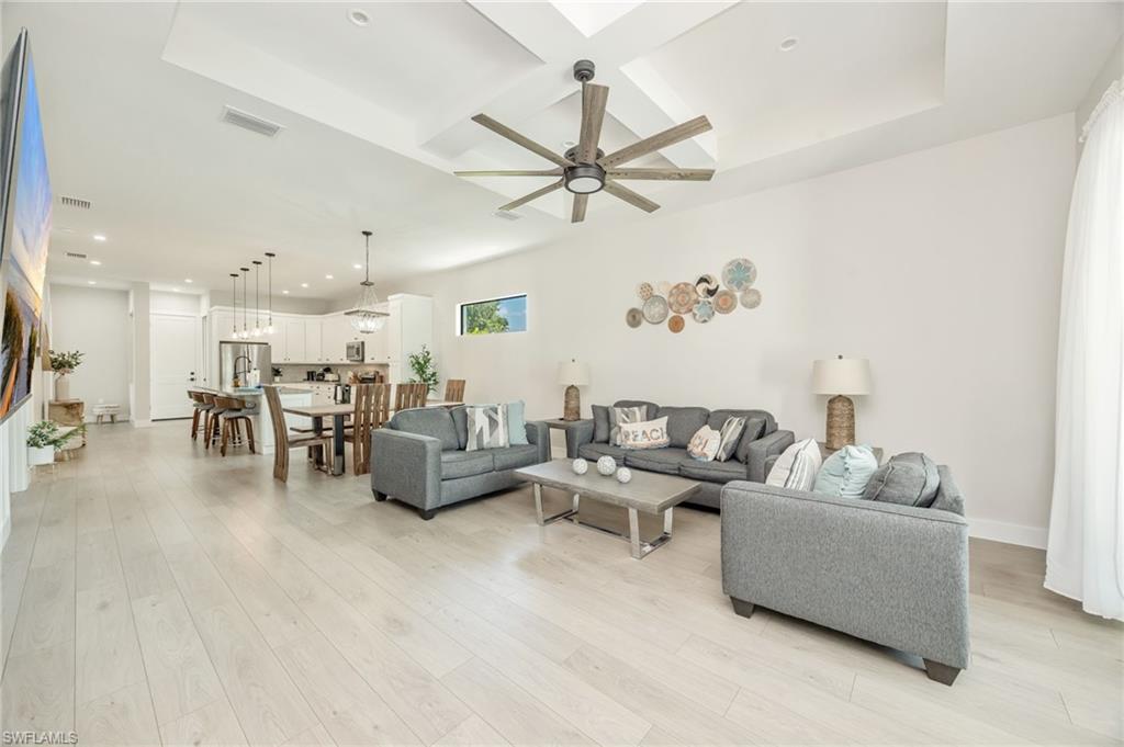 Open-concept living space featuring wood-finish flooring throughout