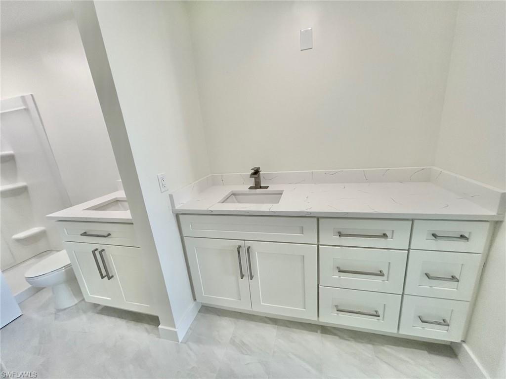 New Bathroom, 2 sinks, shower, and walk in closet.