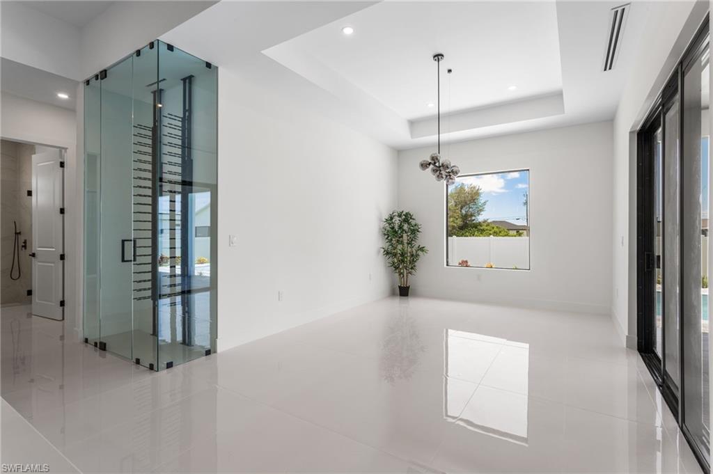 Formal Dining Room with Big Picture Windowand Chandelier