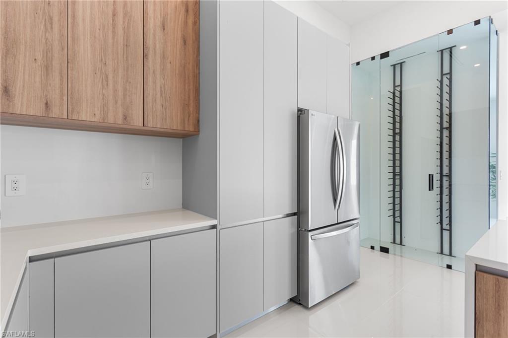 A DEDICATED WINE CLOSET with 55-bottleDISPLAY RACK adds a LUXURIOUS TOUCH toyour ENTERTAINING SPACE!