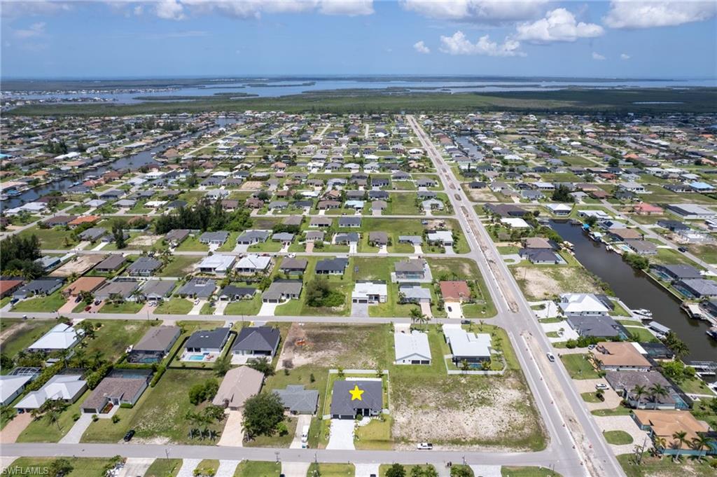Located near the upcoming SEVEN ISLANDSWATERFRONT COMMUNITY in NW Cape Coral,featuring future marinas, parks, dining, andresort-style amenities, this property offersINCREDIBLE POTENTIAL!!!