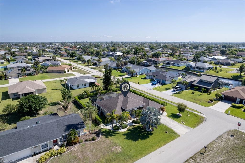 Aerial perspective showcasing a residential neighborhood with numerous single-story homes