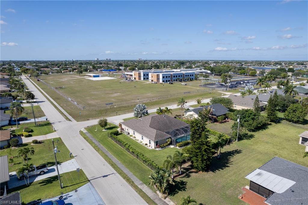 Aerial perspective showcasing a residential neighborhood with broad streets and ample green spaces
