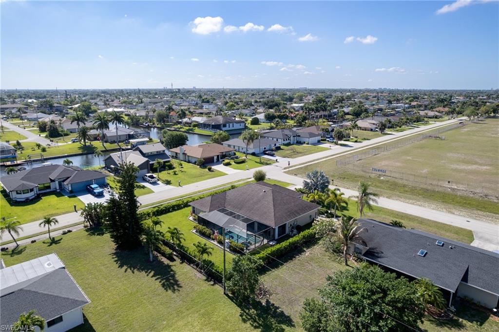 Aerial perspective showcasing a residential neighborhood with numerous single-story homes