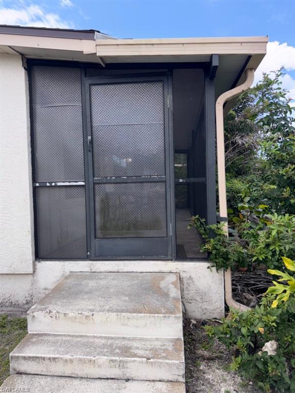 Screened porch entry with concrete steps