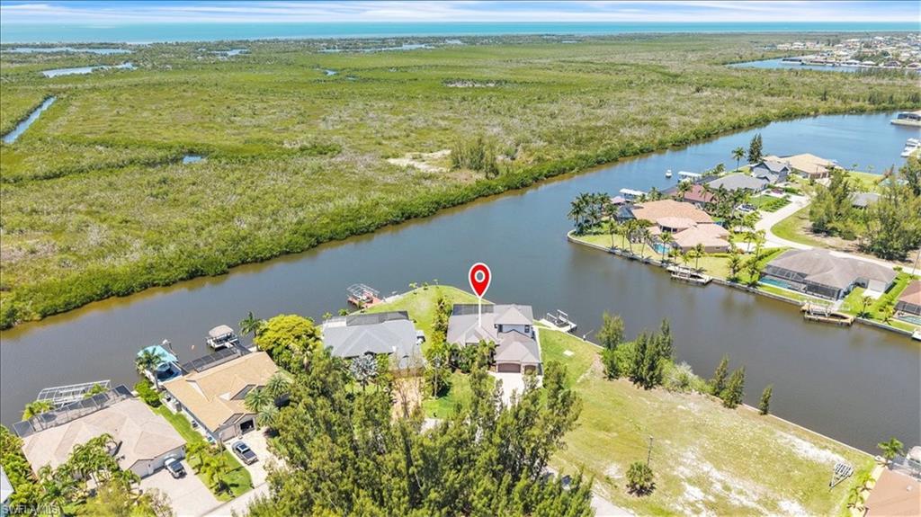 Waterfront property featuring a private boat dock and direct canal access