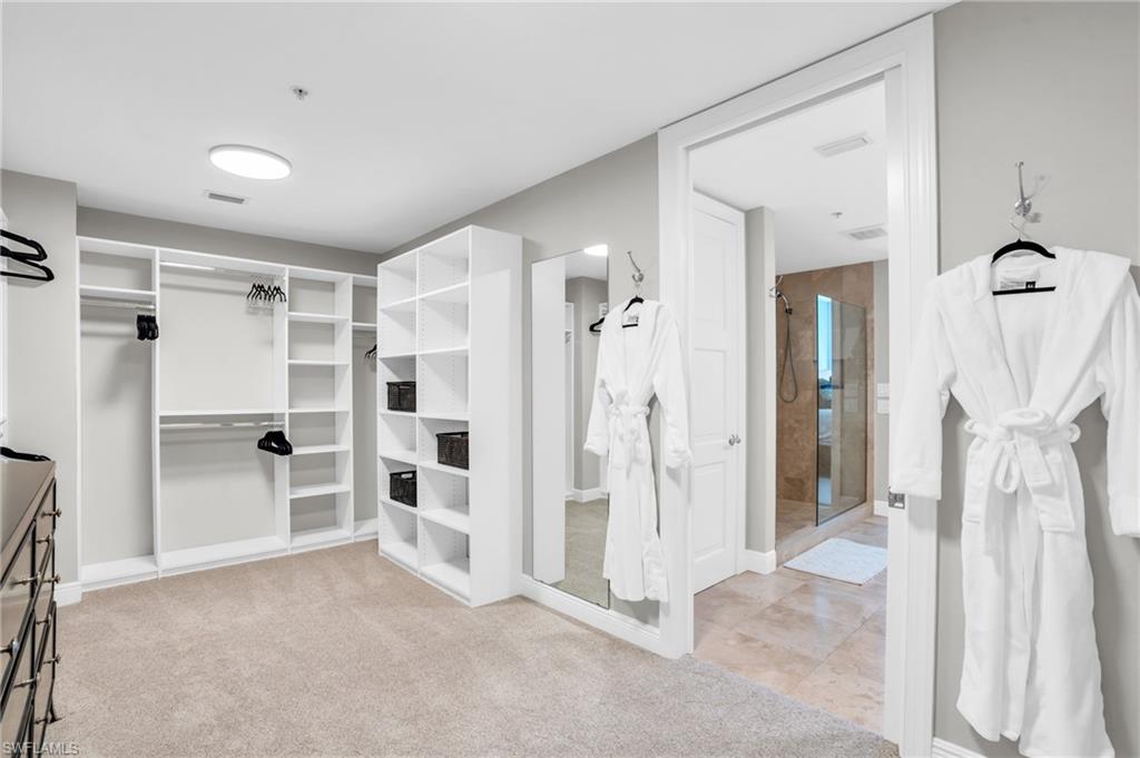 Walk in closet featuring light tile patterned flooring