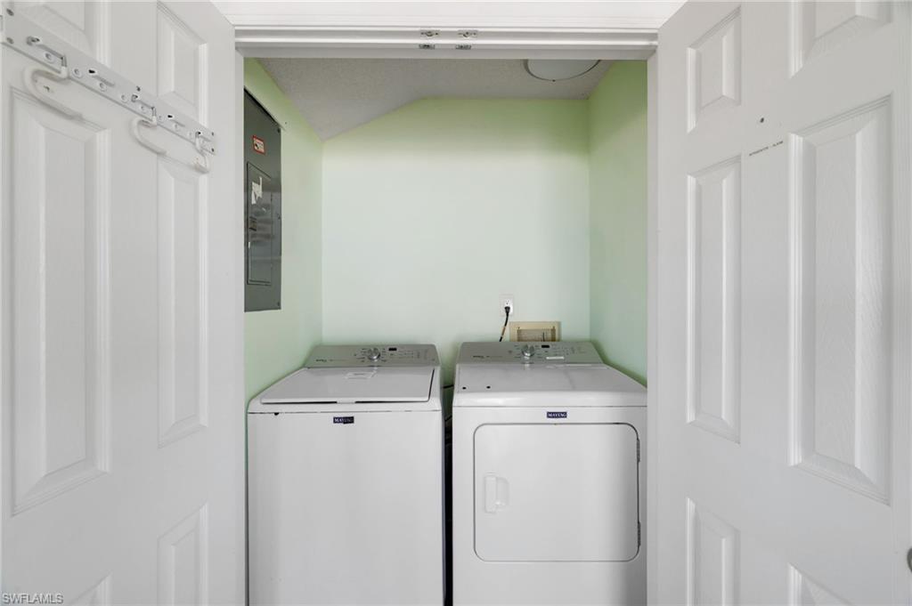 Dedicated laundry closet with bi-fold panel doors - Virtually Edited Image