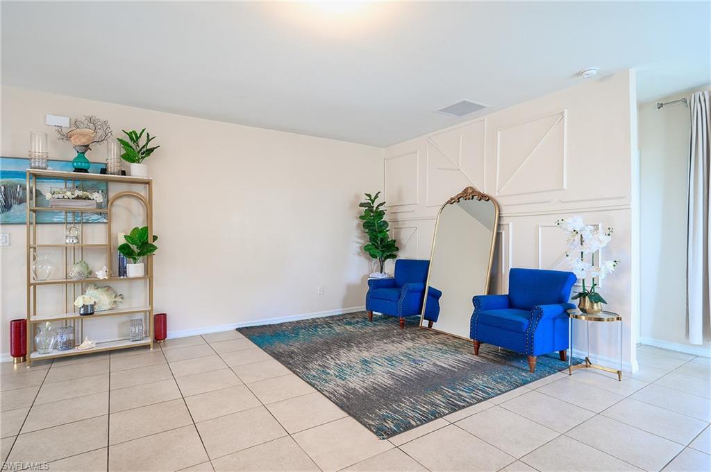 Neutral tile flooring spanning the room