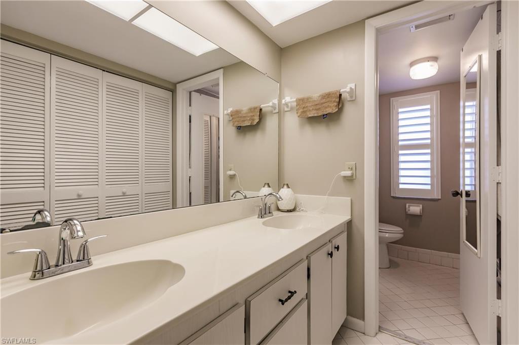 Primary Bathroom with dual sinks and separate shower area.