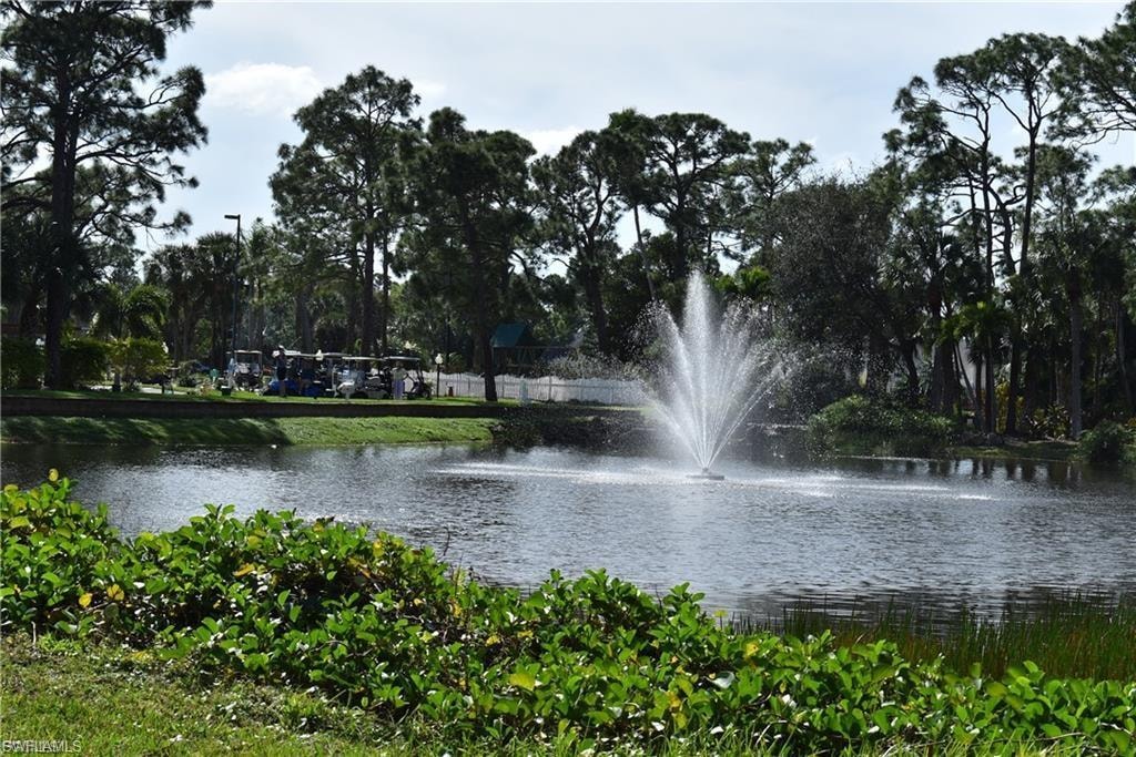 Surrounding community featuring a water view