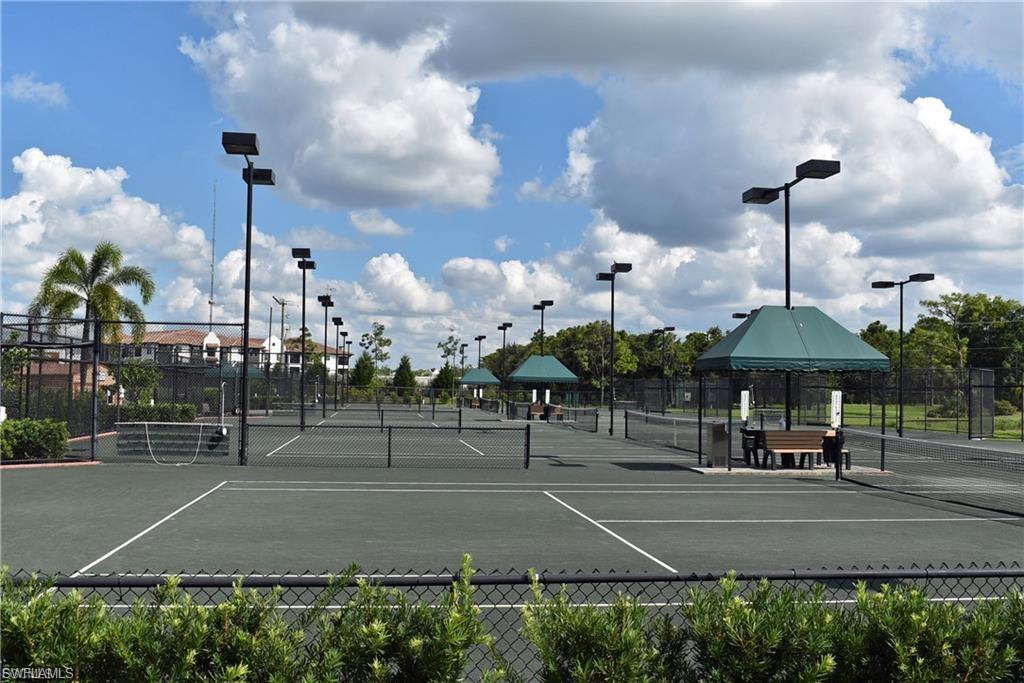 View of tennis court featuring community basketball court