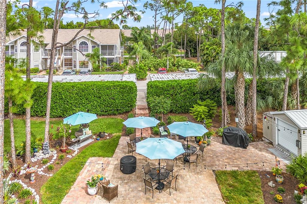 View of patio featuring area for grilling and outdoor dining area