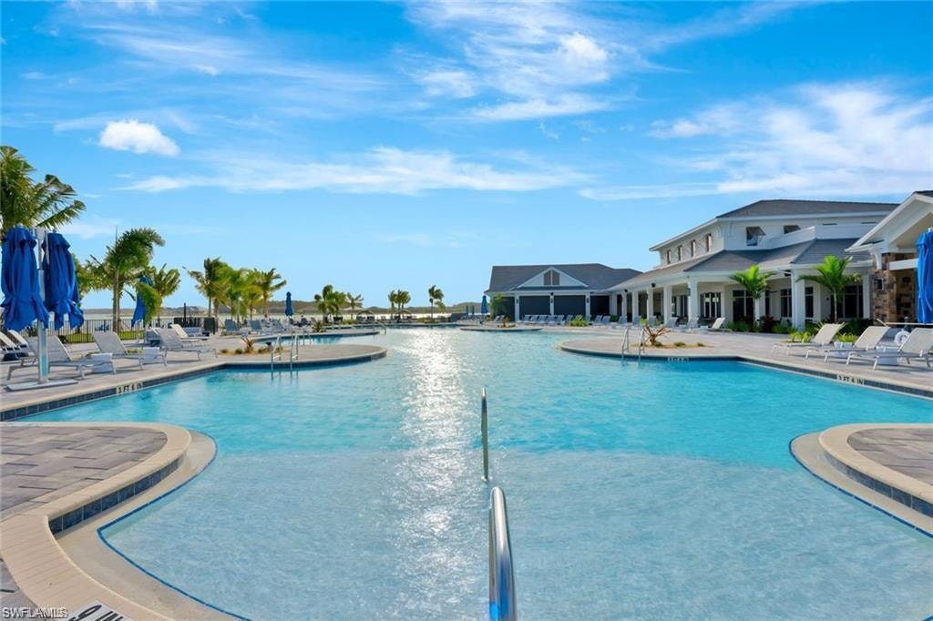 Community pool with a patio