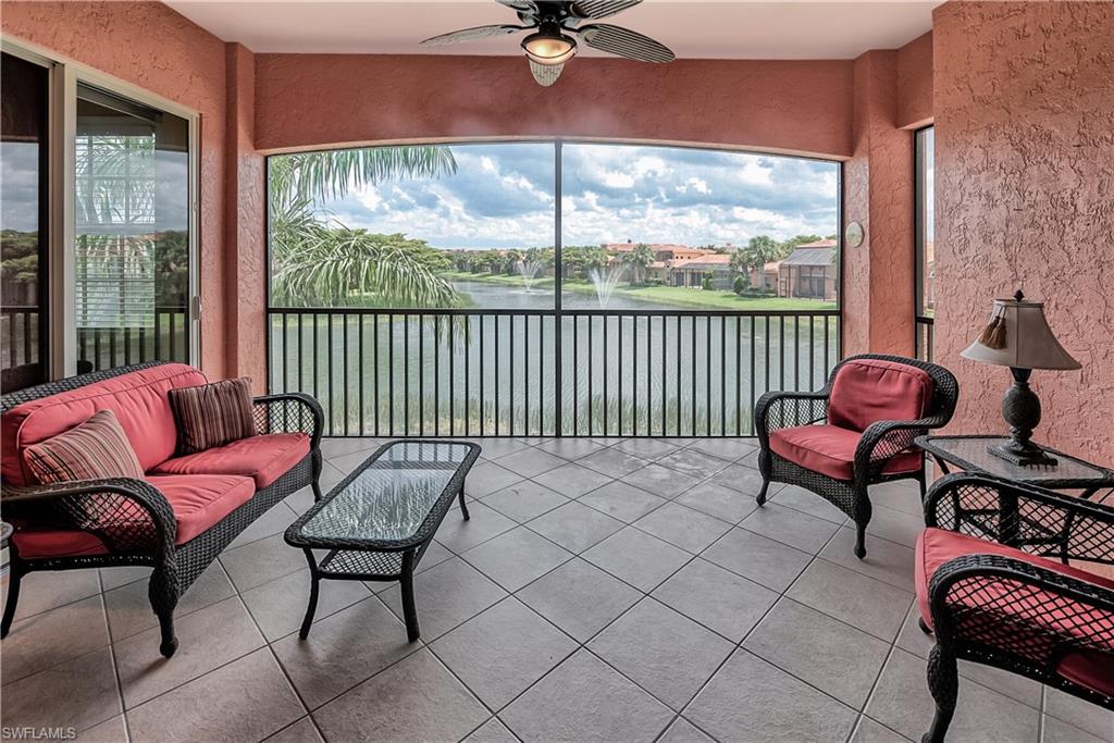 Sunroom with a water view