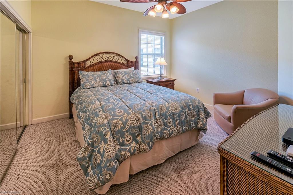 Bedroom with carpet, a closet, and ceiling fan